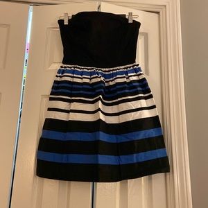 Black, Cobalt, and White strapless dress.